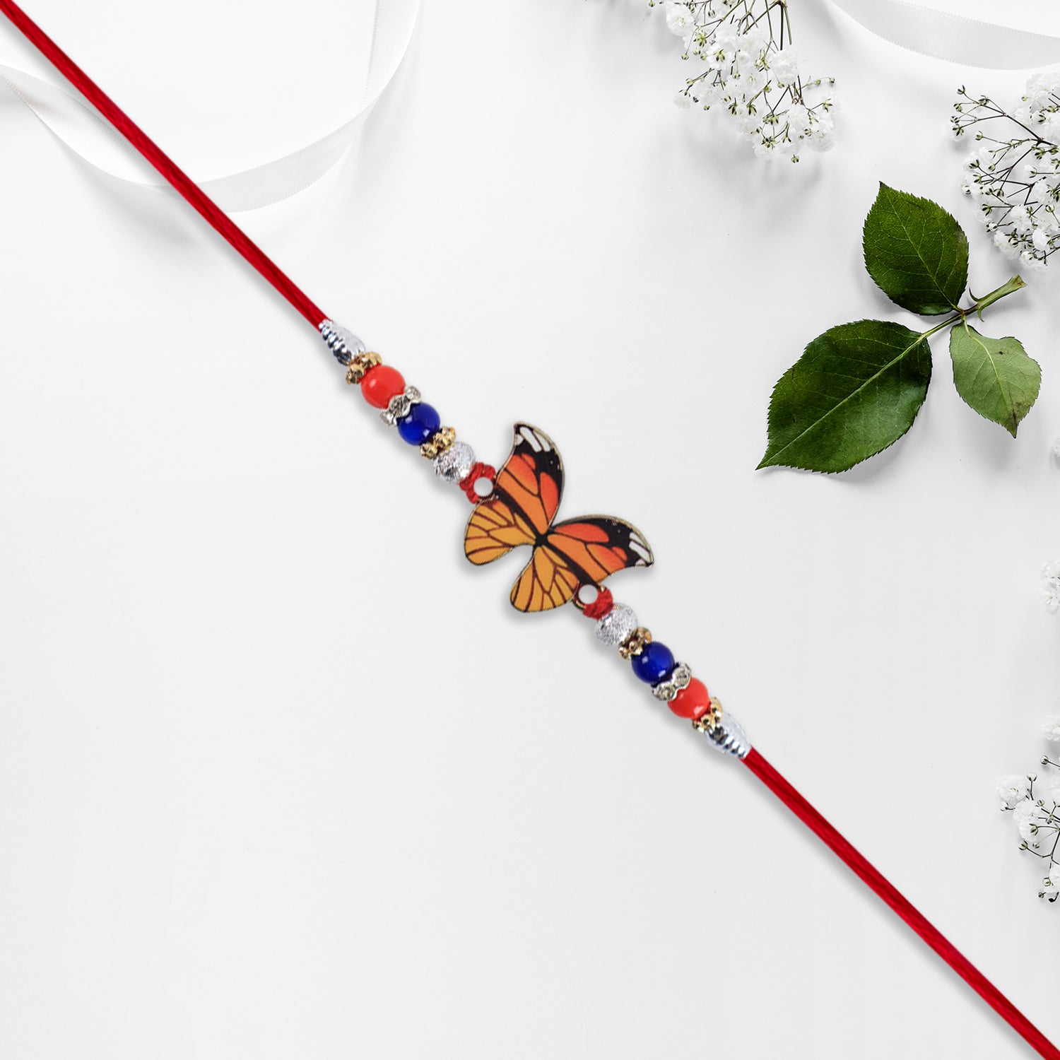 Vibrant Butterfly Rakhi With Colorful Beads  Red Mauli Thread Vibrant Butterfly Rakhi With Colorful Beads  Red Mauli Thread